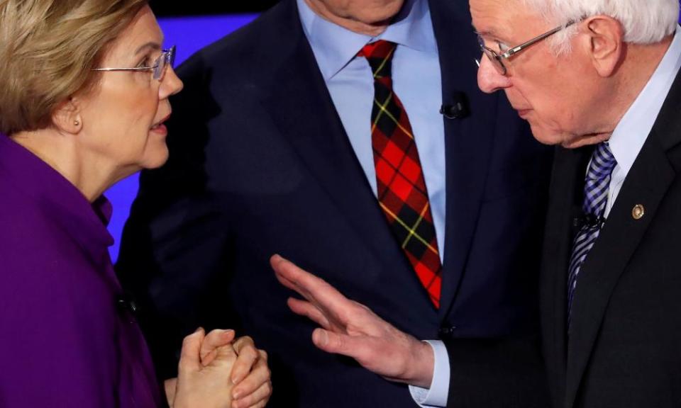 Elizabeth Warren and Bernie Sanders face off at the Democratic debate in Des Moines, Iowa.