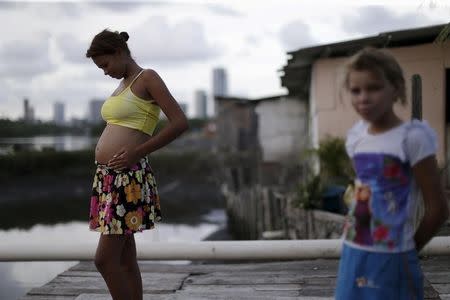 Eritania Maria, who is six months pregnant, is seen in front of her house at a slum in Recife, Brazil, February 2, 2016. REUTERS/Ueslei Marcelino