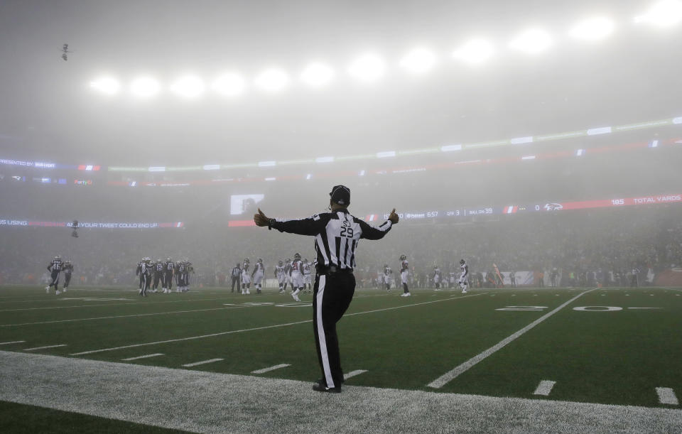 <p>Fog settles over the field as side judge Adrian Hill works along the sideline during the second half of an NFL football game between the New England Patriots and the Atlanta Falcons, Sunday, Oct. 22, 2017, in Foxborough, Mass. (AP Photo/Charles Krupa) </p>