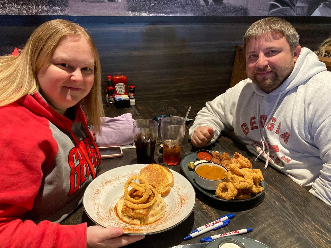 Christy and Brandon Adams of Perry ordered the Mardi Gras mahi and the Louisiana combo at the new Walk-On’s Sports Bistreaux in Warner Robins.