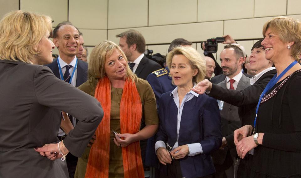 Female defense ministers, from left, Albania's Mimi Kodheli, Netherland's Jeanine Hennis-Plasschaert, Germany's Ursula von der Leyen, Norway's Ine Marie Eriksen Soreide and Italy's Roberta Pinotti pose for photographers prior to the start of a meeting of defense ministers of the North Atlantic Council at NATO headquarters in Brussels on Wednesday, Feb. 26, 2014. Frustrated with his Afghan counterpart, U.S. President Barack Obama is ordering the Pentagon to accelerate planning for a full U.S. troop withdrawal from Afghanistan by the end of this year. But Obama is also holding out hope that Afghanistan's next president may eventually sign a stalled security agreement that could prevent the U.S. from having to take that step. (AP Photo/Virginia Mayo)