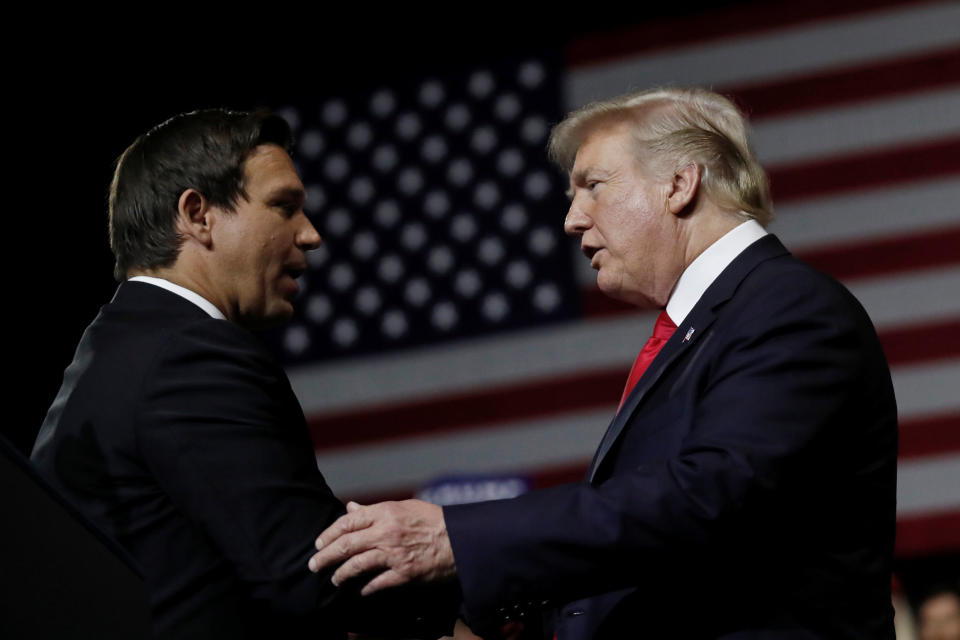 President Donald Trump talks with Ron DeSantis during a Make America Great Again Rally at the Florida State Fairgrounds in Tampa, Florida, on July 31, 2018.&nbsp; (Photo: Carlos Barria/Reuters)