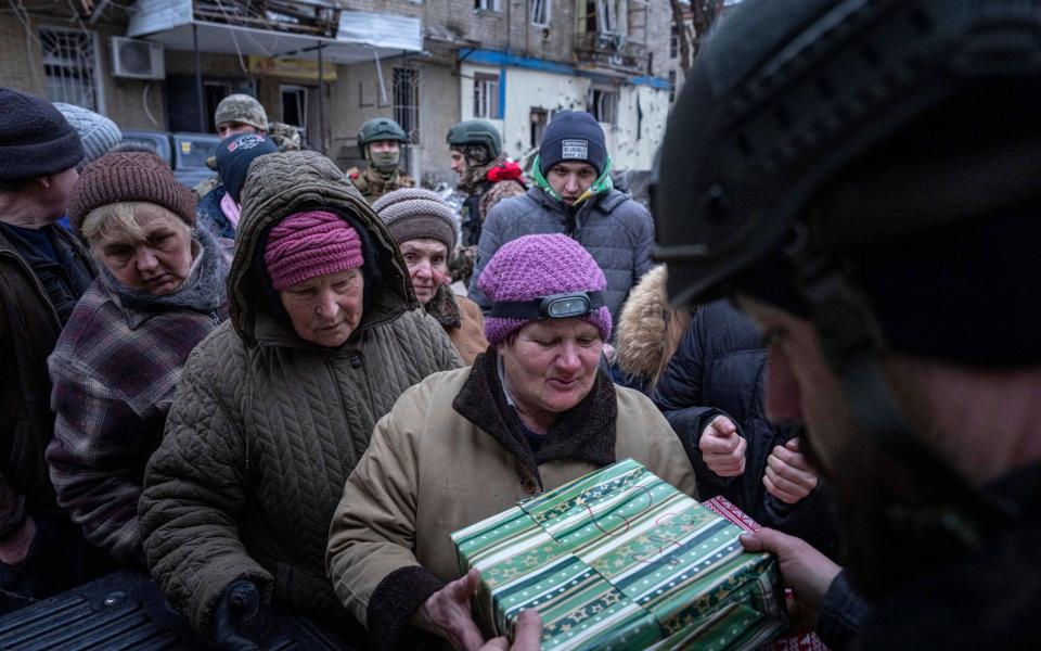 Residents - AP Photo/Evgeniy Maloletka