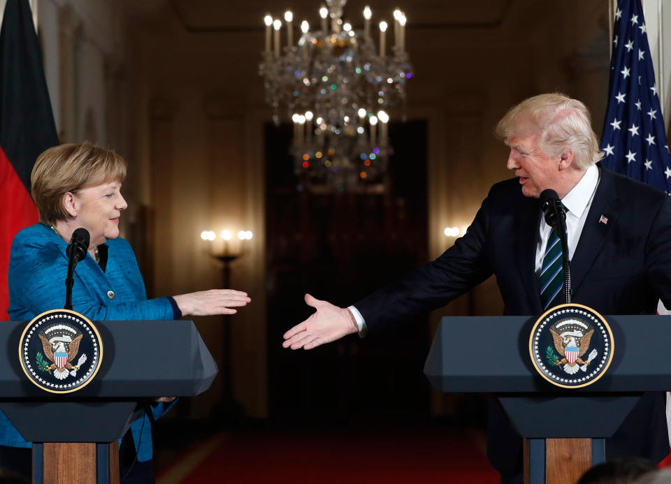 <p>President Donald Trump and German Chancellor Angela Merkel reach to shakes hands after their joint news conference in the East Room of the White House in Washington, Friday, March 17, 2017. (Photo: Pablo Martinez Monsivais/AP) </p>