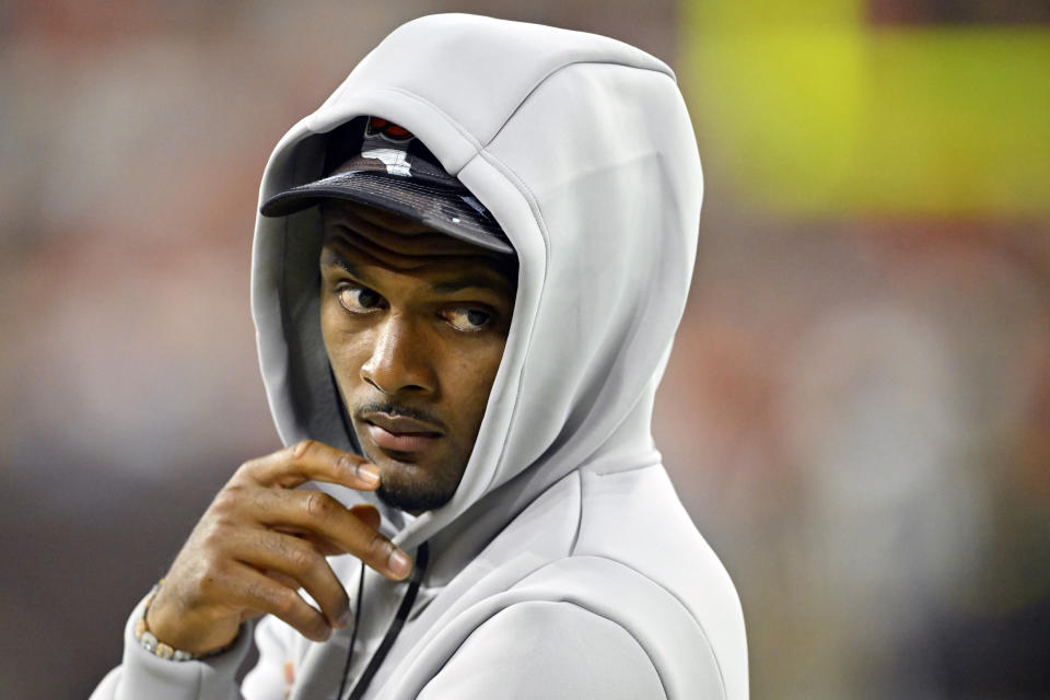 FILE 0 Cleveland Browns quarterback Deshaun Watson stands on the field during an NFL preseason football game against the Chicago Bears, Saturday, Aug. 27, 2022, in Cleveland. othing can slow the NFL’s popularity, but there are significant, unsavory off-field issues that are looming over the league as the season heads to the second half: multiple investigations of Commanders owner Daniel Snyder; the suspension and pending return of Browns QB Deshaun Watson; the lawsuit brought by Steelers assistant coach Brian Flores. (AP Photo/David Richard, File)