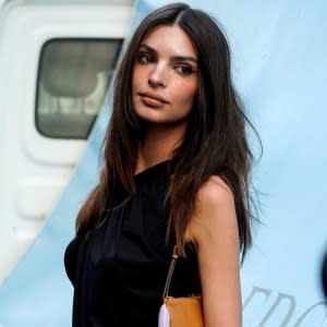 Emily Ratajkowski Pairs A Denim Skirt with Cowboy Boots with Her