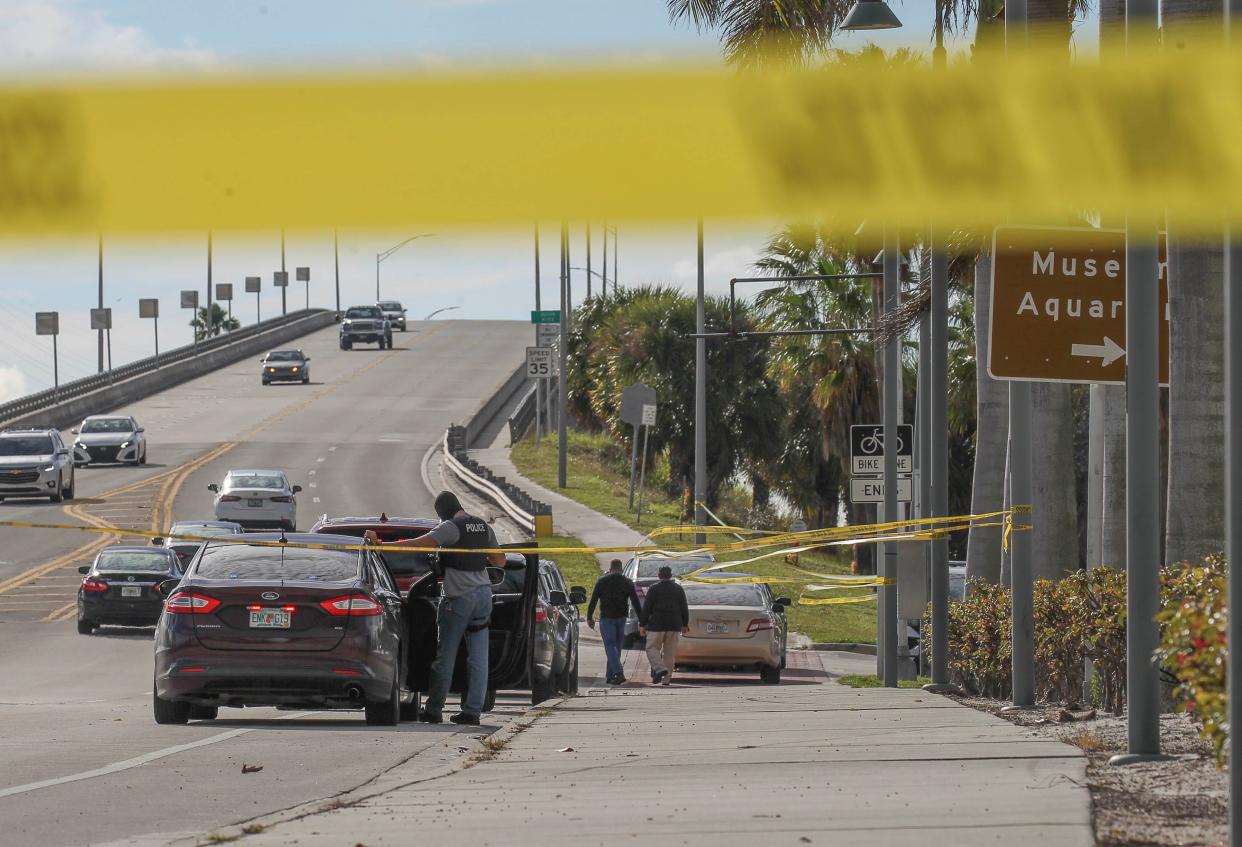 Fort Pierce Police undercover officers and crime scene Investigators work in the area of the Indian River Lagoon shoreline parking at Museum Pointe Park while investigating a shooting involving an Fort Pierce police officer and the arrest of a suspect on Tuesday, Dec. 26, 2023, in Fort Pierce.