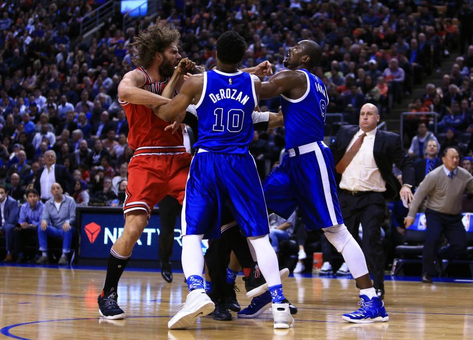 <p>Robin Lopez #8 of the Chicago Bulls fights with DeMar DeRozan #10 and Serge Ibaka #9 of the Toronto Raptors during the second half of an NBA game at Air Canada Centre on March 21, 2017 in Toronto, Canada. NOTE TO USER: User expressly acknowledges and agrees that, by downloading and or using this photograph, User is consenting to the terms and conditions of the Getty Images License Agreement. (Photo by Vaughn Ridley/Getty Images) </p>