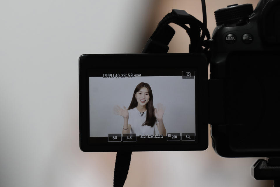 In this Sept. 5, 2019, photo, Kang Na-ra, 22, is seen on a camera monitor as she gives a demonstration of a YouTube channel at a studio in Seoul, South Korea. In South Korea, a handful of young North Korean refugees have launched YouTube channels in recent years to offer a rare glimpse into life in the North. Kang, a North Korean escapee who regularly appears on two YouTube channels and two TV programs, is called “Princess Na-ra” by her fans. (AP Photo/Lee Jin-man)