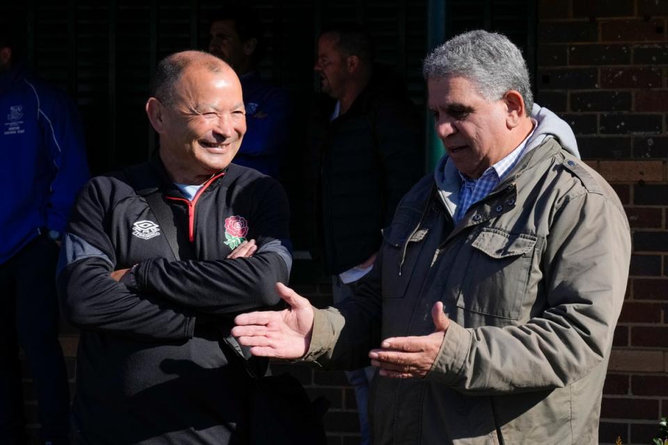 England coach Eddie Jones, left, talks with former Australian rugby player Glen Ella (Mark Baker/AP) (AP)