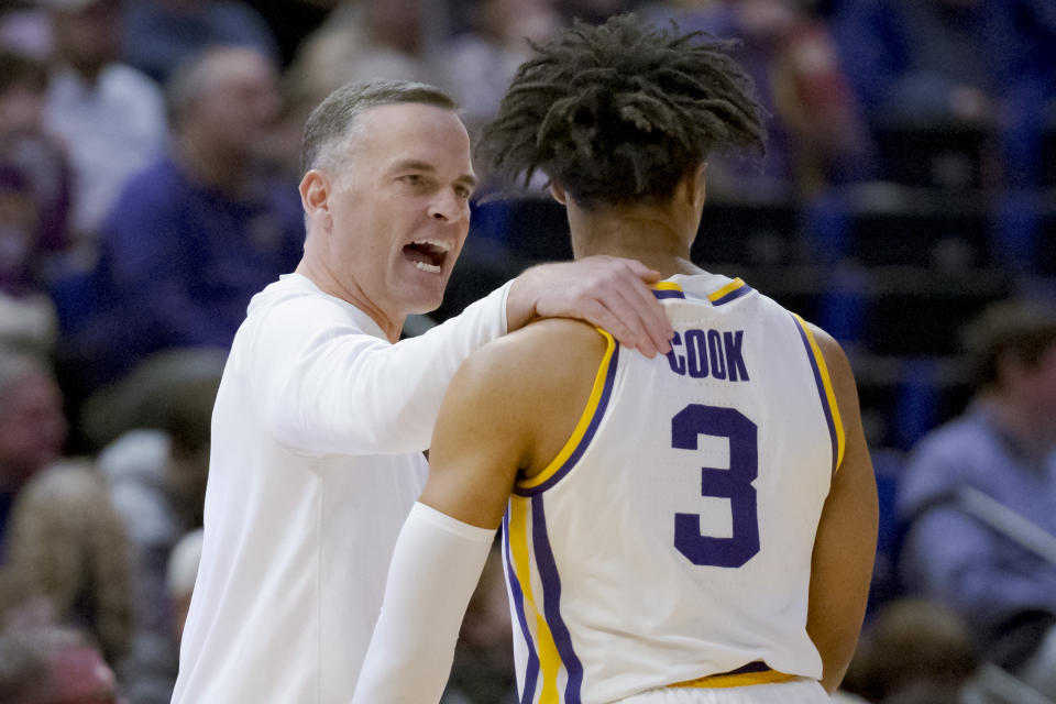 LSU coach Matt McMahon talks to guard Jalen Cook during the first half of the team's NCAA college basketball game against Mississippi in Baton Rouge, La., Wednesday, Jan. 17, 2024. (AP Photo/Matthew Hinton)