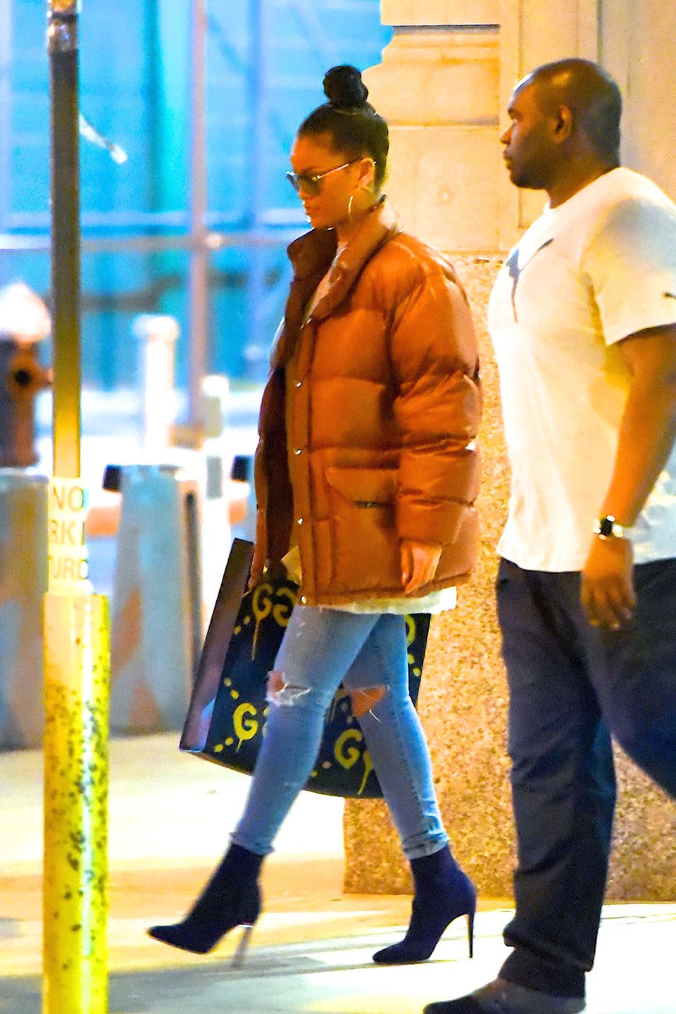 <p>Rihanna continued her puffer-coat-in-the-summer trend in New York City. She paired the jacked with a GucciGhost tote. </p>