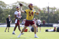 Washington Football Team quarterback Ryan Fitzpatrick (14) throws a pass during NFL football practice in Richmond, Va., Wednesday, July 28, 2021. (AP Photo/Ryan M. Kelly)