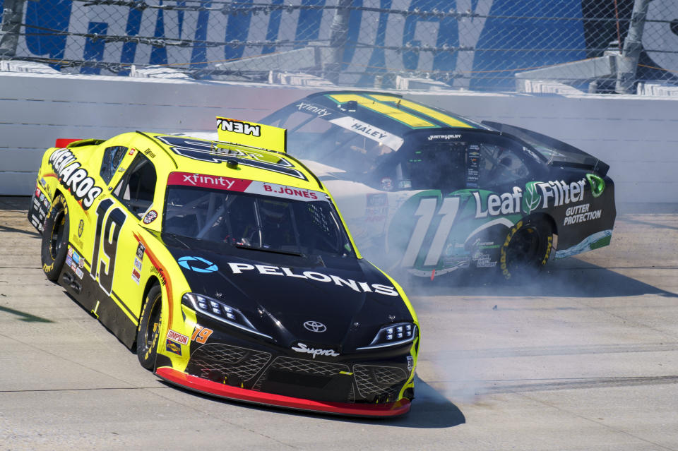 Brandon Jones, left, and Justin Haley, right collide coming out of turn 1 during a NASCAR Xfinity Series auto race at Dover International Speedway, Tuesday, June 15, 2021, in Dover, Del. (AP Photo/Chris Szagola)