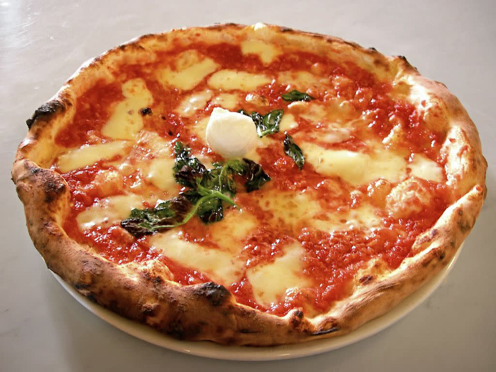 Picture of an authentic Neapolitan Pizza Margherita taken by Valerio Capello on September 6th 2005 in a pizzeria ("I Decumani") located on the Via dei Tribunali in Naples.