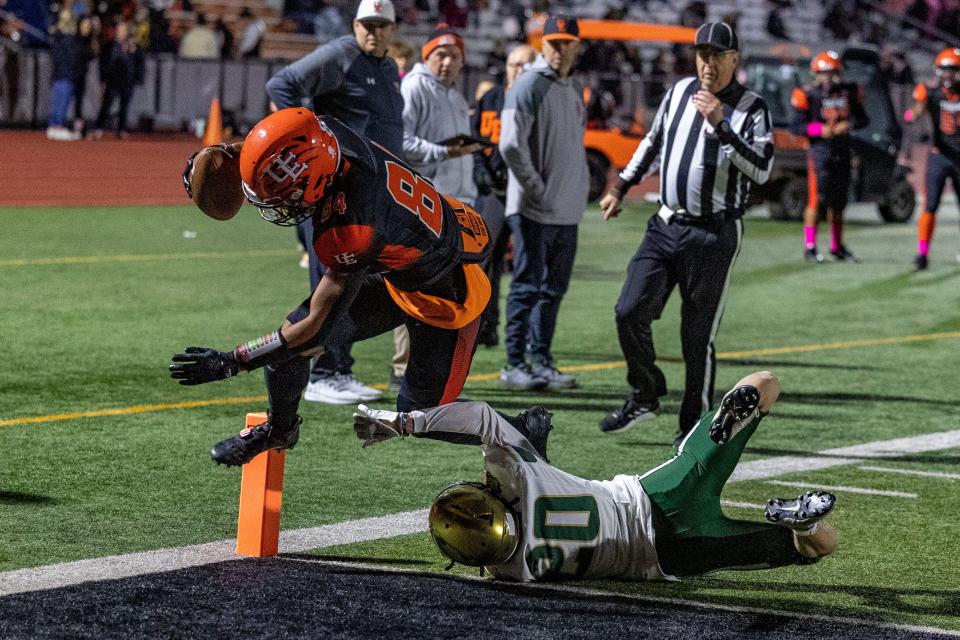 Union-Endicott's Jaheim Jackson (84) goes into the end zone for a touchdown over Vestal's Tucker Zostant (20) during the Tigers' 12-7 win in football Oct. 21, 2022 at Ty Cobb Stadium.