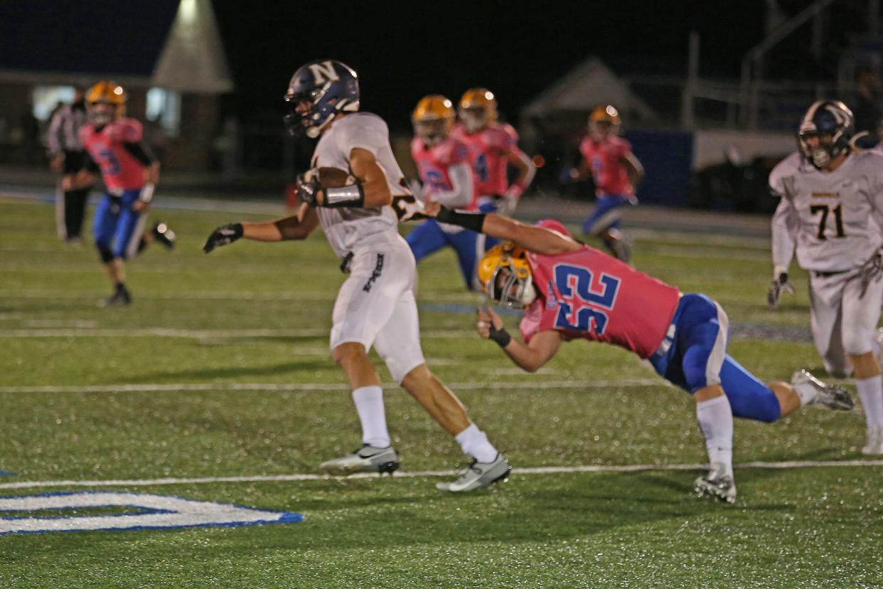 Clyde's Blake Hershey slows down the runner.