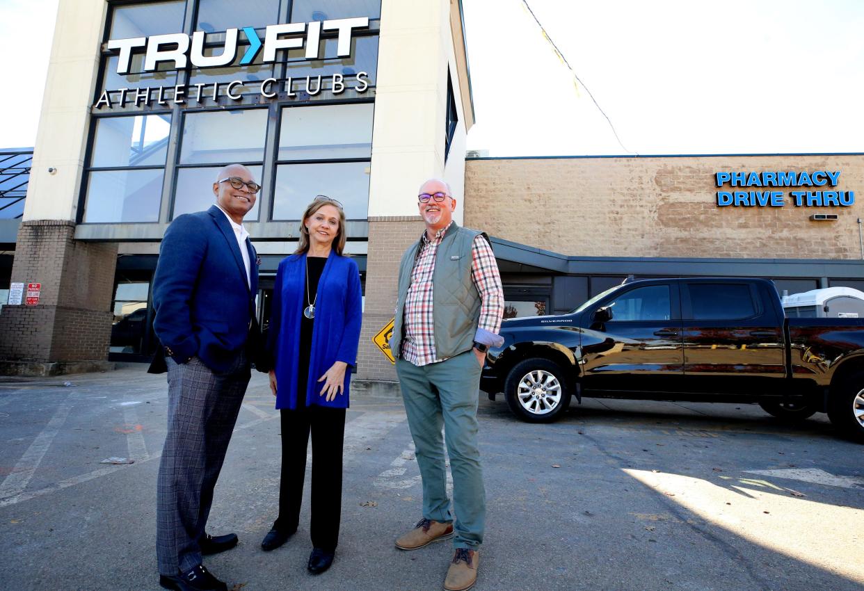 Murfreesboro City Councilman Kirt Wade, left, MTSU nutrition professor Janet Colson, center, and Assistant Murfreesboro City Manager Sam Huddleston, right stand in front of the future site of Tru>Fit Athletic Clubs, on Monday, Nov. 13, 2023, the former site of a Kroger grocery store along Middle Tennessee Blvd.
