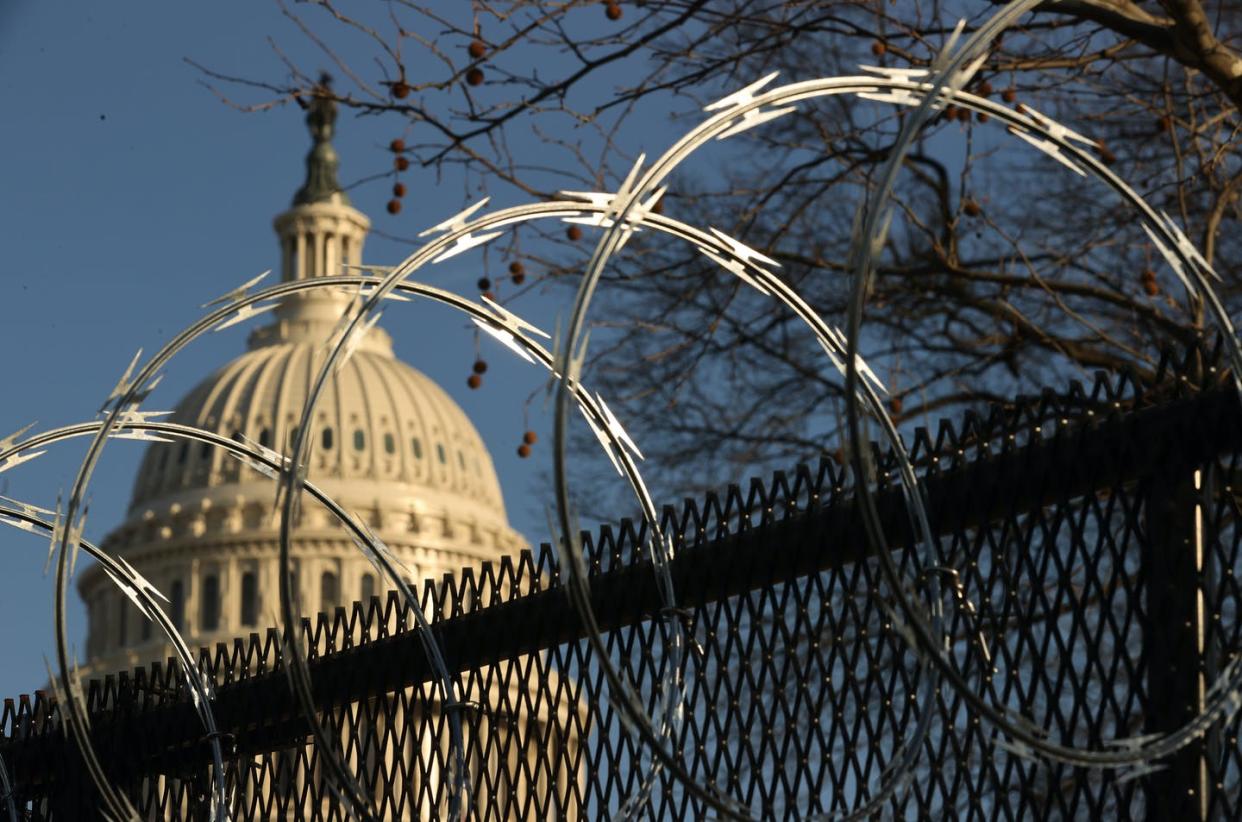 <span class="caption">The impeachment trial shows American democracy is in bad shape.</span> <span class="attribution"><a class="link " href="https://www.gettyimages.com/detail/news-photo/concertina-razor-wire-tops-the-8-foot-non-scalable-fence-news-photo/1296392826?adppopup=true" rel="nofollow noopener" target="_blank" data-ylk="slk:Chip Somodevilla/Getty Images;elm:context_link;itc:0;sec:content-canvas">Chip Somodevilla/Getty Images</a></span>