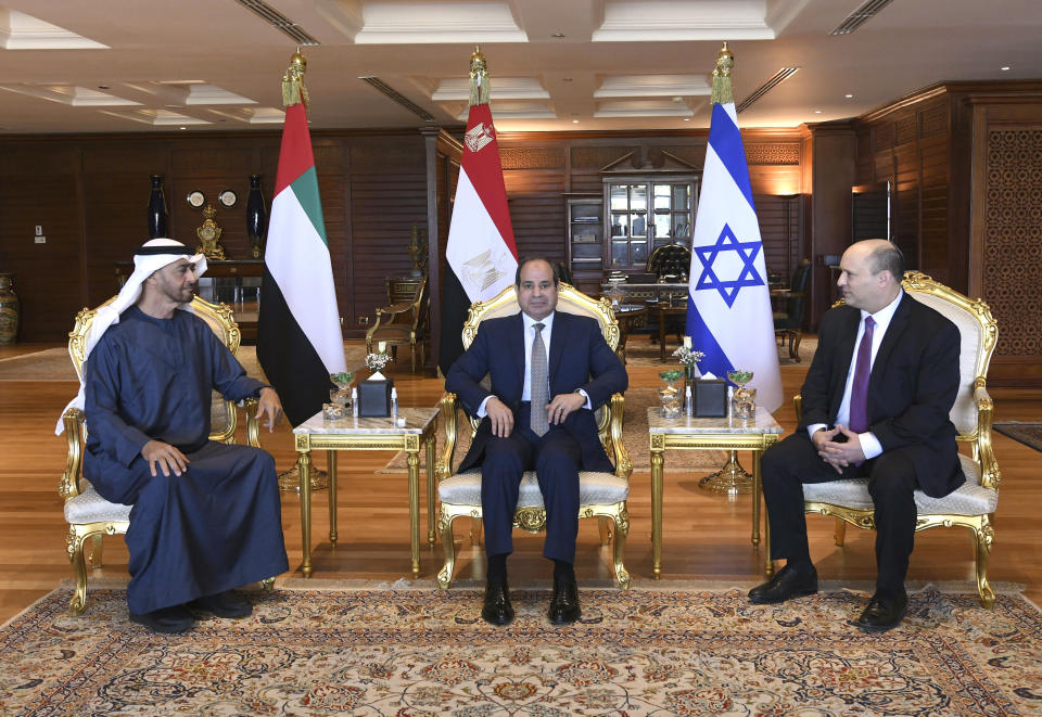 FILE - In this photo provided by the Egyptian Presidency Media Office, Egyptian President Abdel-Fattah el-Sissi, center, meets with then Abu Dhabi Crown Prince Sheikh Mohammed bin Zayed Al Nahyan, left, and Israeli Prime Minister Naftali Bennett in the Red Sea resort of Sharm el-Sheikh, Egypt, Tuesday, March 22, 2022. Al Nahyan the newly appointed president has been receiving condolence visits from the world's elite for days now in Abu Dhabi. MbZ as he’s known has taken on a major influence in the wider Middle East, whether through his longtime relationship with the U.S. military, his opposition to Islamists and his autocratic country’s new ties with Israel. (Egyptian Presidency Media Office via AP, File)