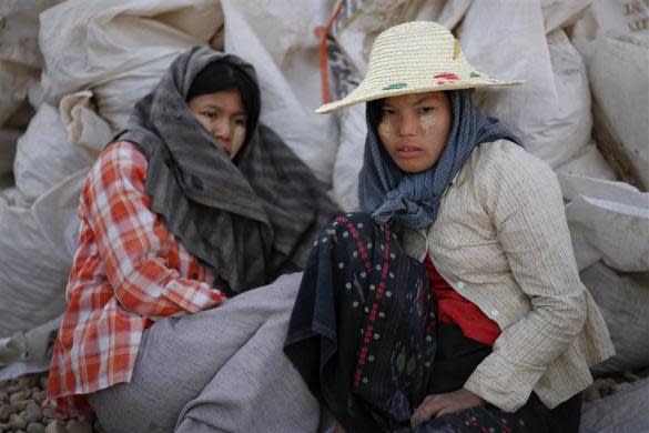 Workers rest at a construction site in capital Naypyitaw, January 24, 2012.