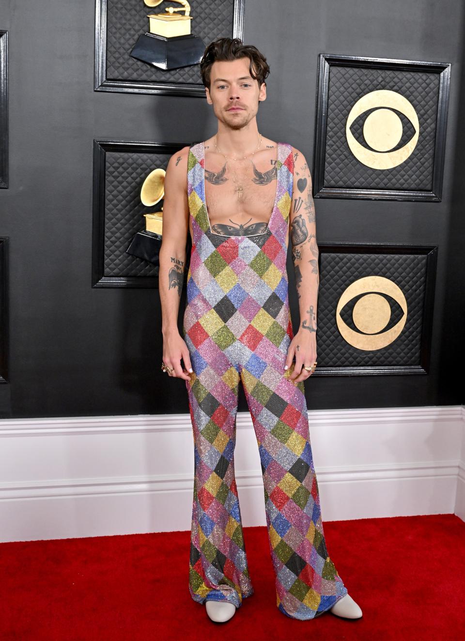 Continuing the color explosion of his <em>Love on Tour</em> looks, Harry Styles attended the 2023 Grammys in a custom crystal bodysuit made in collaboration between EGONLAB and Swarovski.