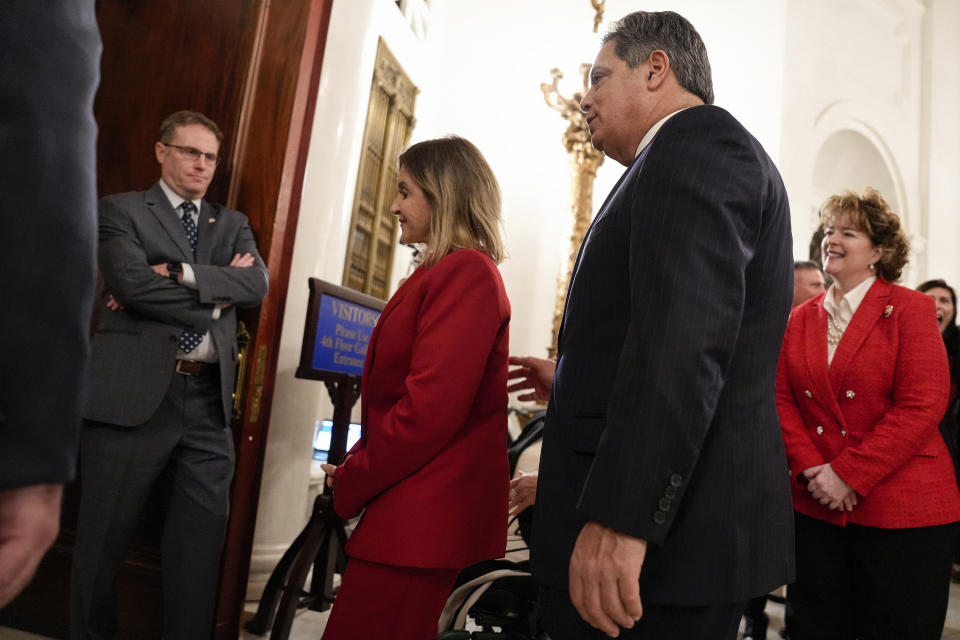 Pennsylvania Senate president pro tempore Kim Ward, left, and Senate Democratic Leader Jay Costa, right, enter the house chambers on swearing-in day, Tuesday, Jan. 3, 2023, at the state Capitol in Harrisburg, Pa. (AP Photo/Matt Smith)