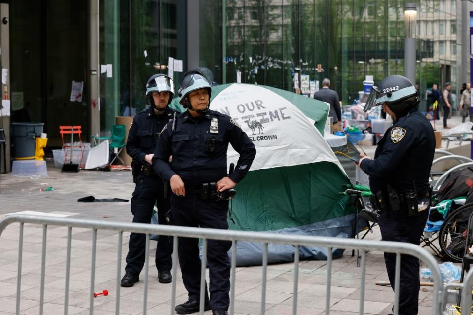 Police wearing riot gear detained over a dozen demonstrators. Kevin C. Downs for NY Post