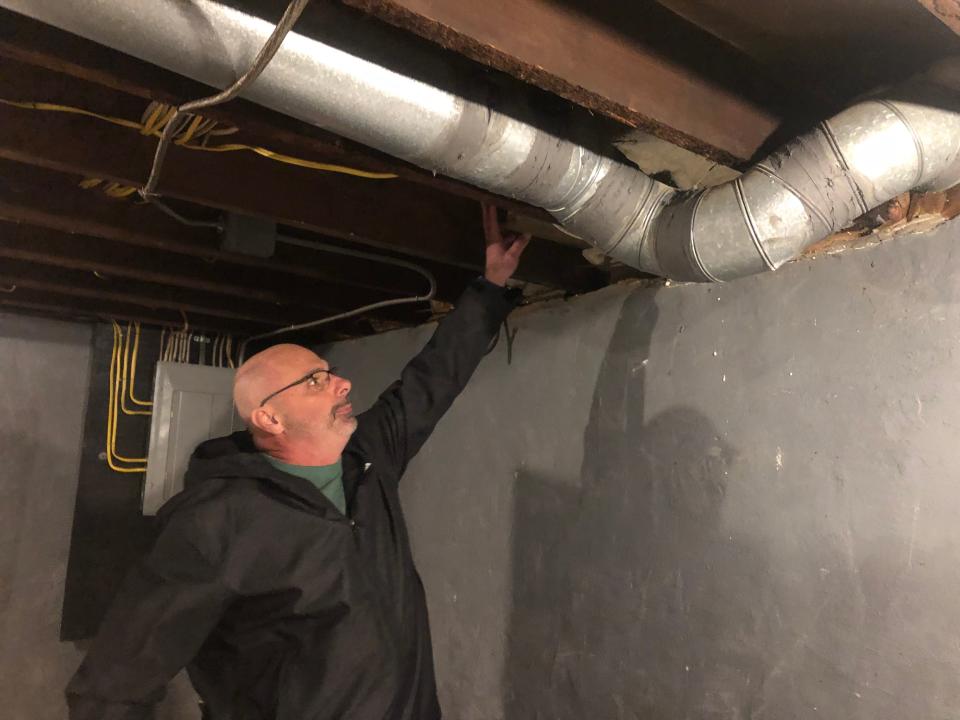 Director of Energy Services for Tioga Opportunities, Jim Wiser, points out the duct work his crew has already done inside a home at 125 West St. in Johnson City.