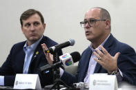 Fred Guttenberg, right, speaks during a school safety roundtable Monday, Nov. 20, 2023, in Coral Springs, Fla. A Congressional delegation, family members and government officials toured Marjory Stoneman Douglas High School, where fourteen students and three staff members were fatally shot in 2018. Guttenberg's son Jaime was killed in the shooting. At left is Rep. Daniel Goldman, D-N.Y. (AP Photo/Lynne Sladky)