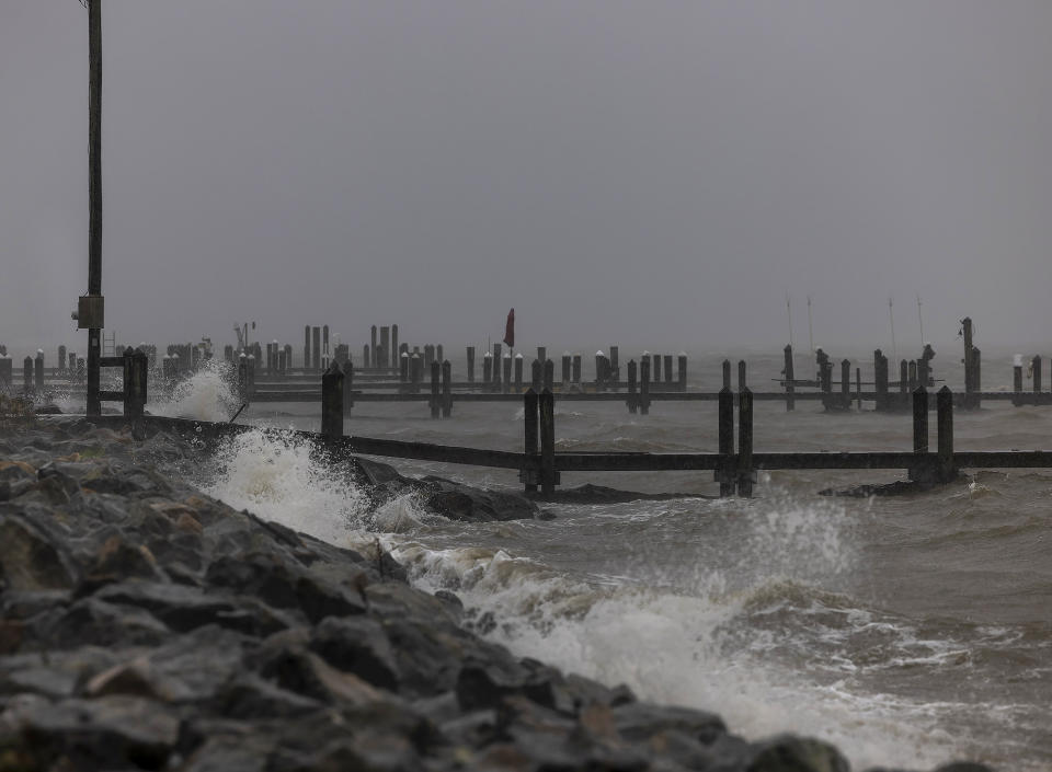 Wind driven waves slam into docks along Irving Avenue as Tropical Storm Ophelia reaches Colonial Beach, in Westmoreland County, Va., on Saturday, Sept. 23, 2023. (Peter Cihelka/The Free Lance-Star via AP)