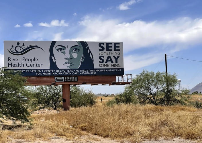 A billboard is seen in Scottsdale, Ariz., Saturday, June 10, 2023, near the health care facility of the Salt River Pima-Maricopa Indian Community, which has been affected by a gigantic Medicaid fraud scheme involving sober living homes that promised help to Native Americans seeking to kick alcohol and other additions. Navajo National Attorney General Ethel Branch said Monday, June 12, 2023, that Navajo law enforcement teams that fanned out over metro Phoenix in recent weeks made contact with several hundred Native Americans from various tribes on the streets amid the state crackdown. (AP Photo/Anita Snow)