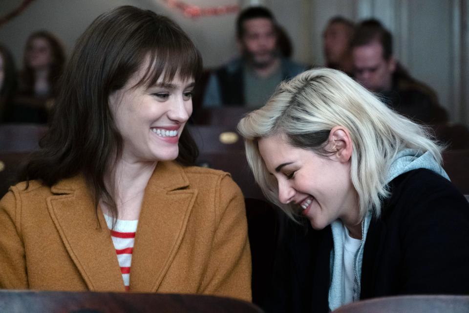 Mackenzie Davis and Kristen Stewart laugh at the movies