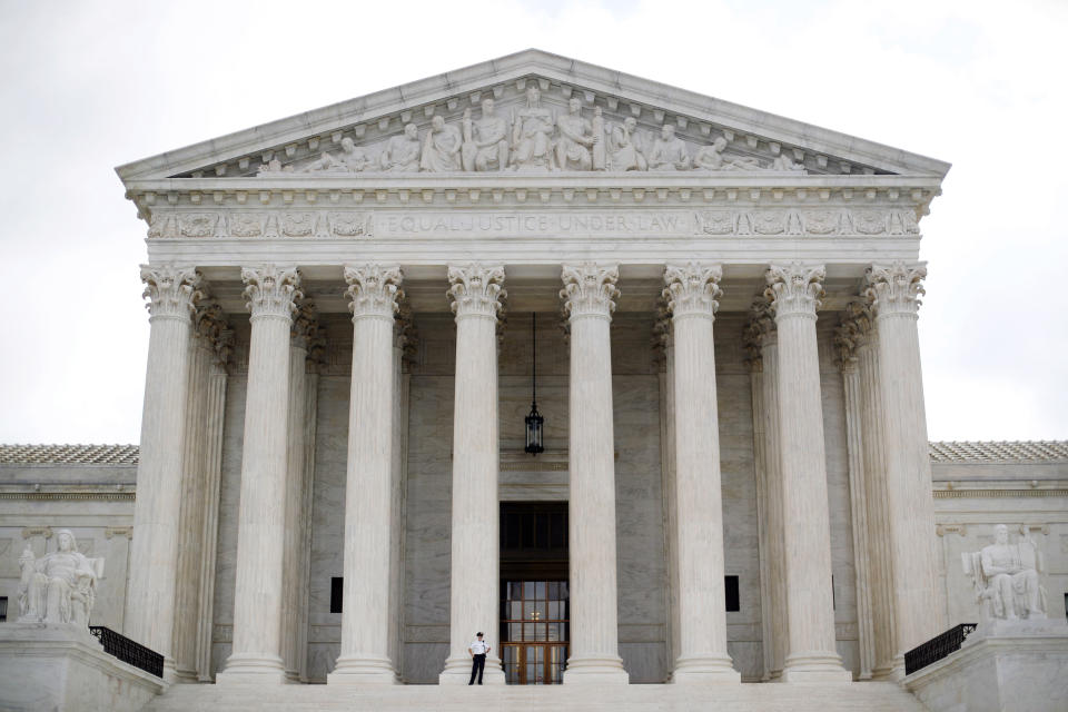 FILE — A police officer guards the main entrance to the Supreme Court in Washington, Oct. 9, 2018. The Supreme Court, Thursday, June 23, 2022, struck down a restrictive New York gun law in a major ruling for gun rights. (AP Photo/Pablo Martinez Monsivais, File)