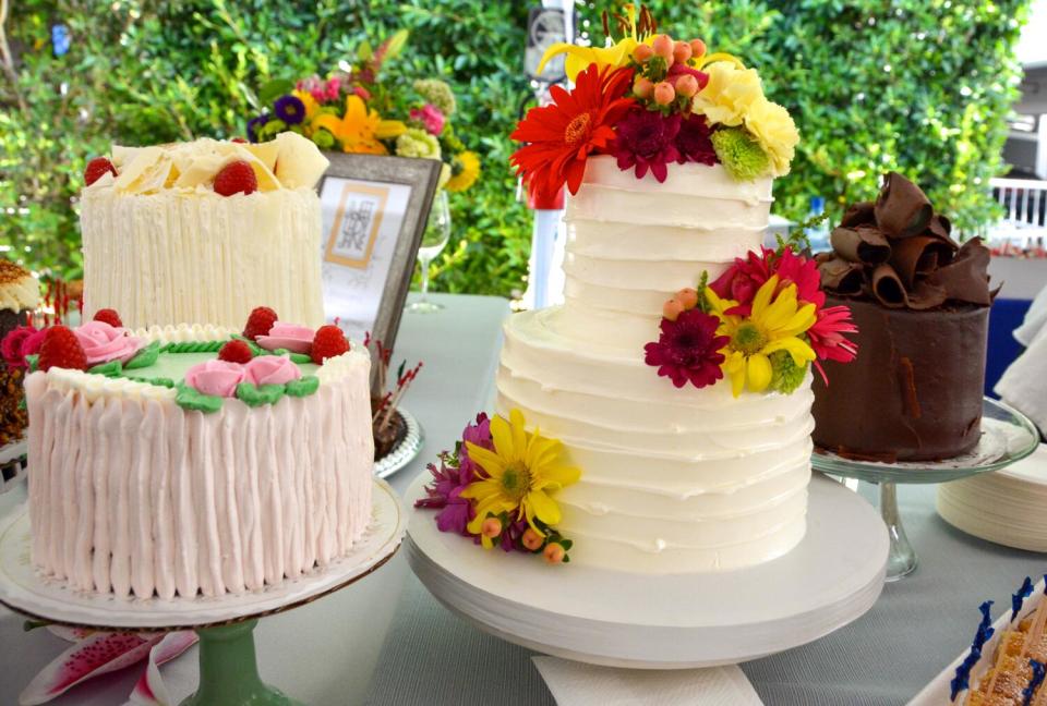 A selection of decorated whole cakes on a table