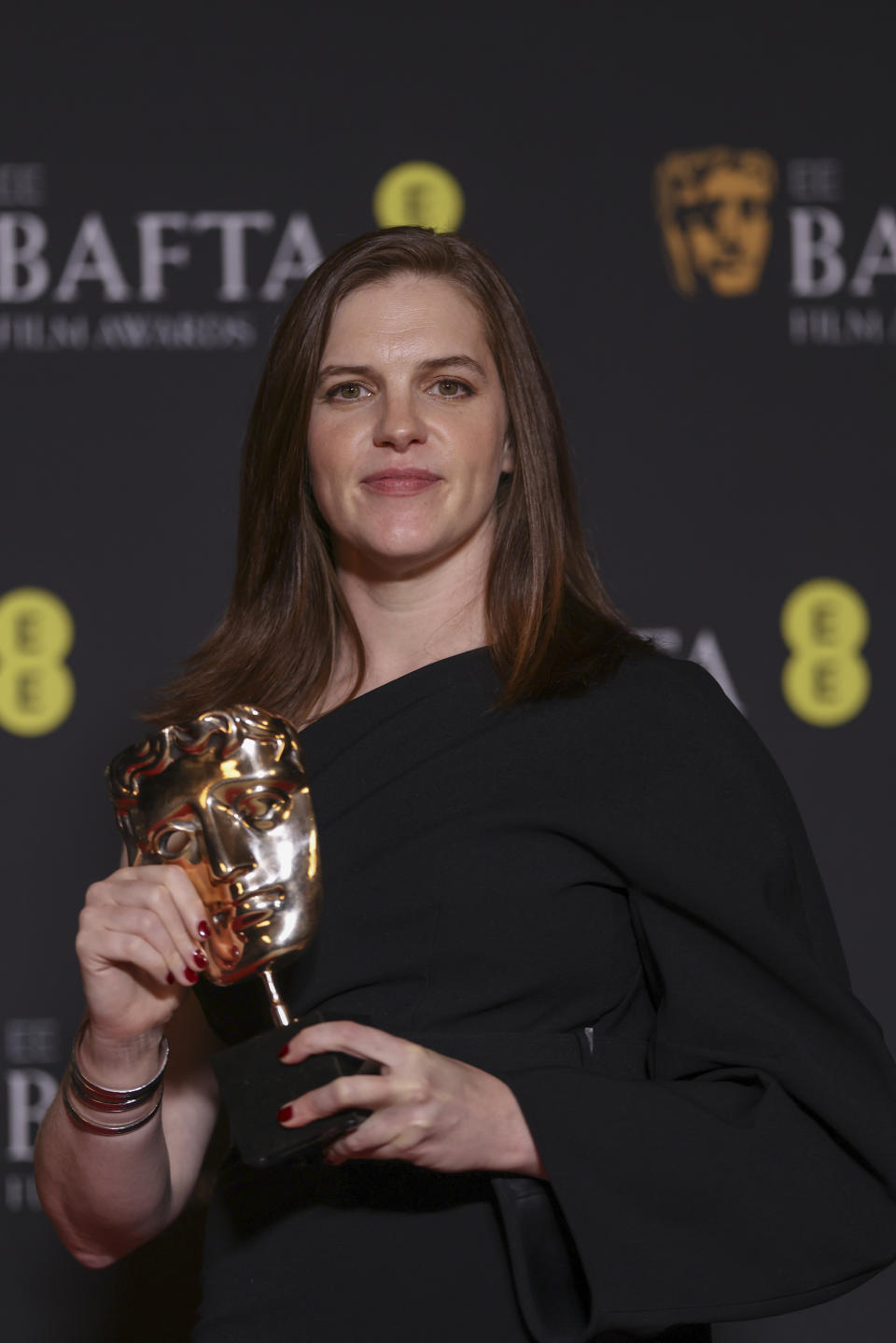 Jennifer Lame, winner of the editing award for 'Oppenheimer', poses for photographers at the 77th British Academy Film Awards, BAFTA's, in London, Sunday, Feb. 18, 2024. (Photo by Vianney Le Caer/Invision/AP)