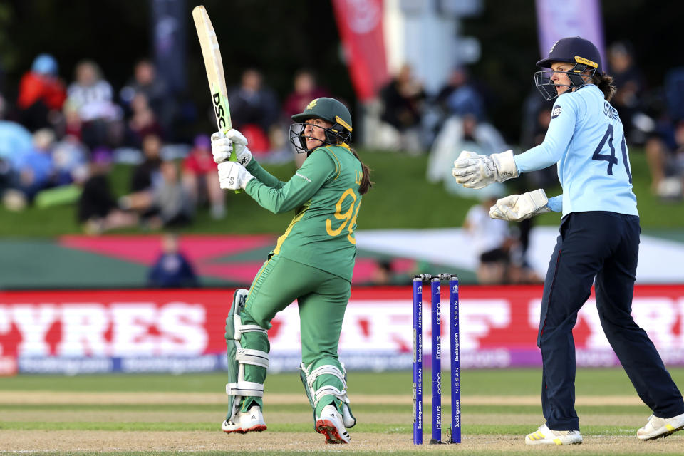 South Africa's Sune Luus, left, bats against England during their semifinal of the Women's Cricket World Cup cricket match in Christchurch, New Zealand, Thursday, March 31, 2022. (Martin Hunter/Photosport via AP)