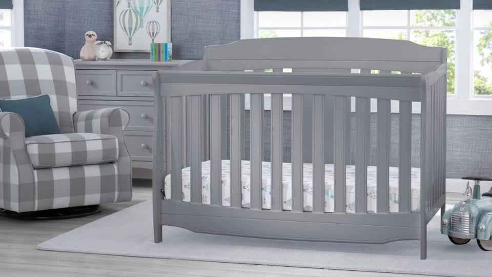 This convertible baby crib from Delta Children is now on sale at Ashley Homestore for $274 off.