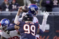 Chicago Bears outside linebacker Trevis Gipson (99) hits New York Giants quarterback Mike Glennon causing a fumble, during the first half of an NFL football game Sunday, Jan. 2, 2022, in Chicago. (AP Photo/Charles Rex Arbogast)