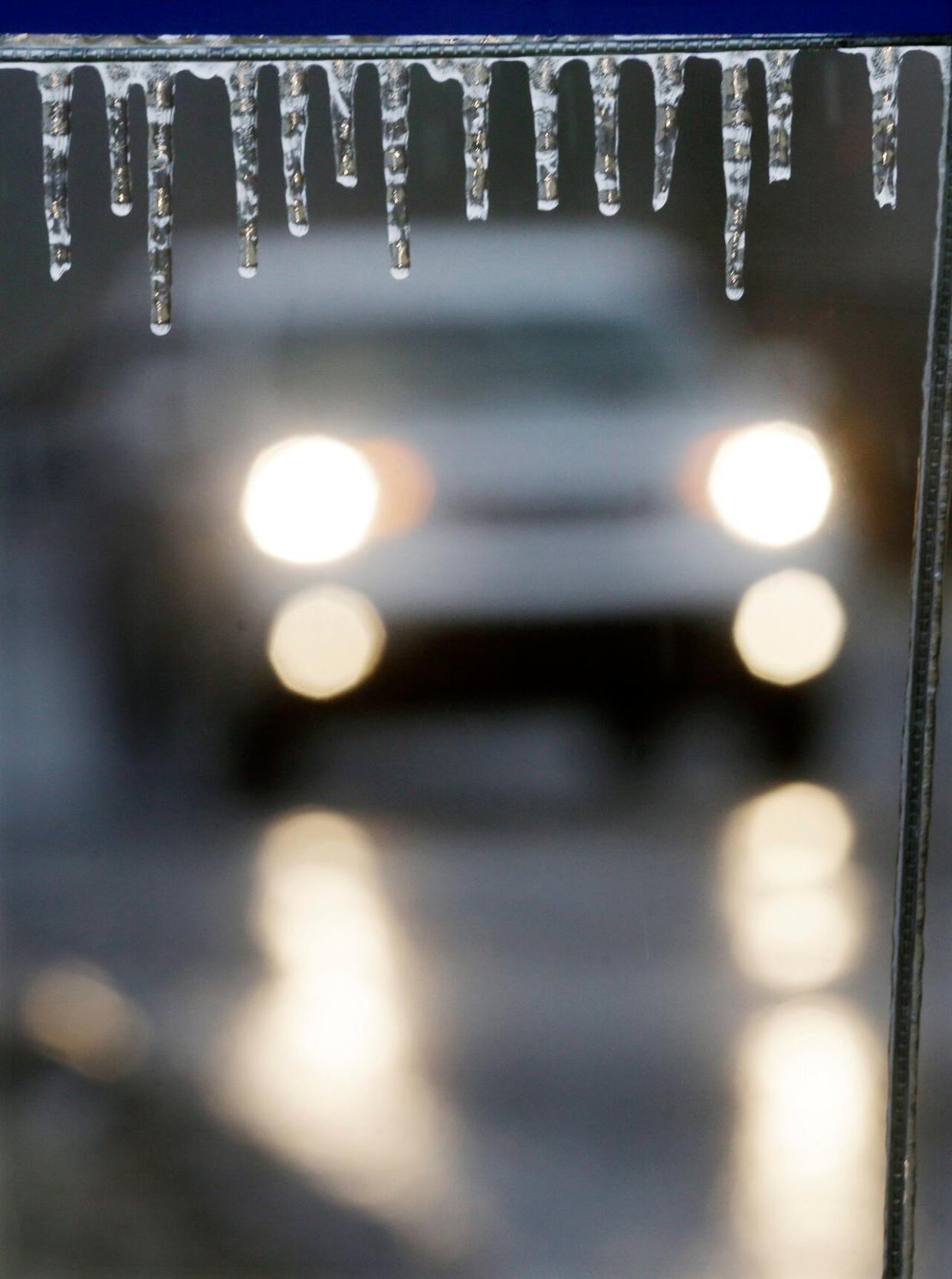 Environment Canada is cautioning that the frozen ground has a reduced ability to absorb the large amounts of rainfall. (Mel Evans/The Associated Press - image credit)