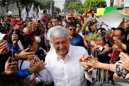 Leftist front-runner Andres Manuel Lopez Obrador of the National Regeneration Movement (MORENA) greets supporters during his campaign rally in Mexico City, Mexico May 2, 2018. REUTERS/Carlos Jasso