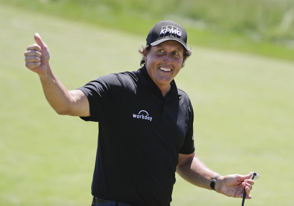 A European golf pro put the ultimate trust in Phil Mickelson’s short game, risking injury to allow “Lefty” to pull off a remarkable trick shot. (AP)