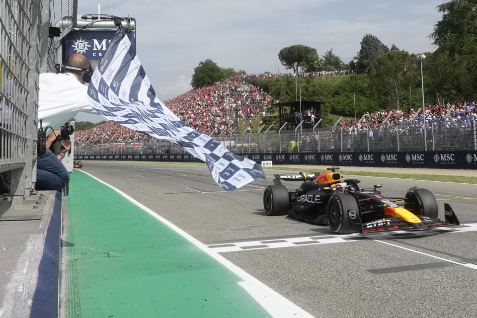 Red Bull driver Max Verstappen of the Netherlands crosses the finish line to win the Italy's Emilia Romagna Formula One Grand Prix race at the Dino and Enzo Ferrari racetrack in Imola, Italy, Sunday, May 19, 2024. (AP Photo/Luca Bruno, Pool)