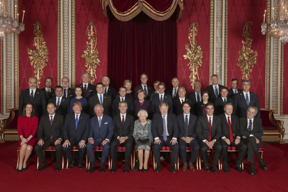 Leaders of the NATO alliance countries, and its secretary general, join Britain's Queen Elizabeth II and Prince Charles the Prince of Wales, for a group picture during a reception at Buckingham Palace in London, Tuesday Dec. 3, 2019, as they gathered to mark 70-years of the alliance. Back row, from left: Xavier Bettel Prime Minister of Luxembourg; Egils Levits President of Latvia; Gitanas Nauseda President of Lithuania; Dusko Markovic Prime Minister of Montenegro; Erna Solberg Prime Minister of Norway; Mark Rutte Prime Minister of Netherlands; Zuzana Caputova President of Slovakia; Andrzej Duda President of Poland; Antonio Costa Prime Minister of Portugal; Klaus Iohannis President of Romania; Marjan Sarec Prime Minister of Slovenia. Middle row from left: Edi Rama Prime Minister of Albania; Zoran Zaev Prime Minister of North Macedonia; Mette Frederiksen Prime Minister of Denmark; Juri Ratas Prime Minister of Estonia; Emmanuel Macron President of France; Angela Merkel President of Germany; Kyriakos Mitsotakis Prime Minister of Greece; Viktor Orban Prime Minister of Hungary; Katrin Jakobsdottir Prime Minister of Iceland; Giuseppe Conte Prime Minister of Italy; Andrej Plenkovic Prime Minister of Croatia. Seated from left: Sophie Wilmas Prime Minister of Belgium; Rumen Radev President of Bulgaria; Donald Trump President of United States; Prince Charles The Prince of Wales; Jens Stoltenberg NATO Secretary General; Queen Elizabeth II; Boris Johnson Prime Minister of the United Kingdom; Justin Trudeau Prime Minister of Canada; Pedro Sanchez Acting Prime Minister of Spain; Recep Tayyip Erdogan President of Turkey; Milos Zeman President of the Czech Republic. (Yui Mok/Pool via AP)
