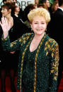 <p>Debbie Reynolds, who passed away on Dec. 28 just one day after daughter Carrie Fisher, stunned in this emerald green and gold sequined number. </p>