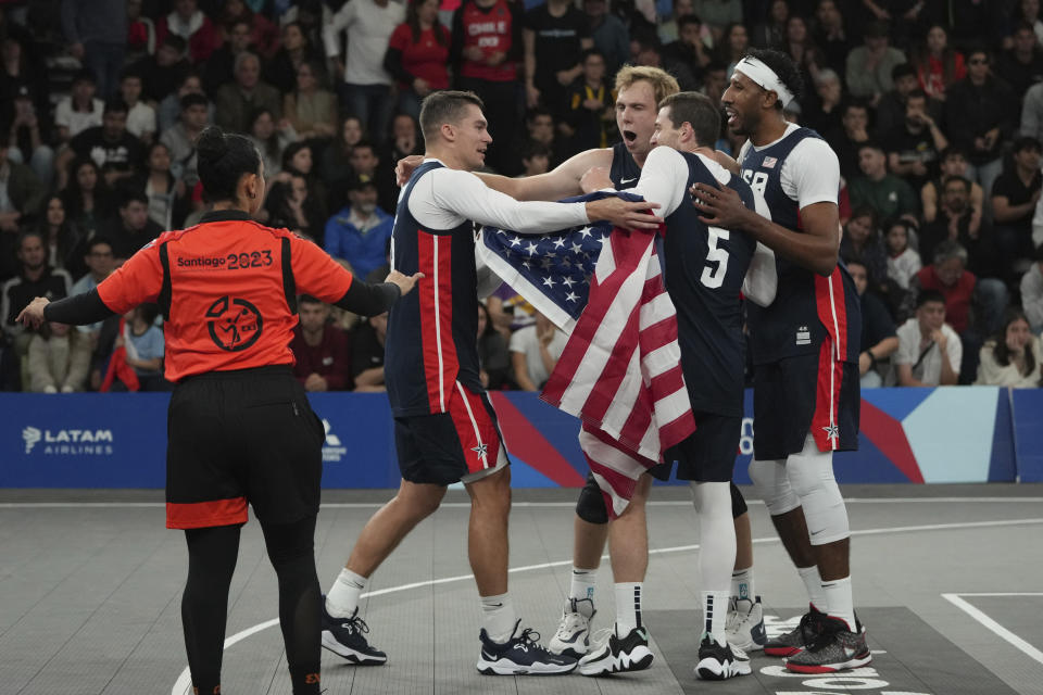 The United States team celebrates winning men's 3x3 basketball final match against Chile at the Pan American Games in Santiago, Chile, Monday, Oct. 23, 2023. (AP Photo/Dolores Ochoa)