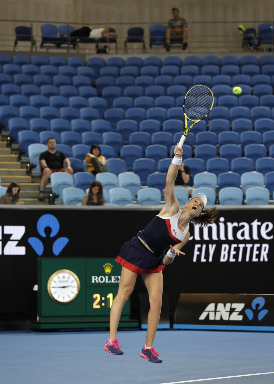 Britain's Johanna Konta serves to Spain's Garbine Muguruza a spectator sleeps in the stands during their second round match at the Australian Open tennis championships in Melbourne, Australia, Friday, Jan. 18, 2019. (AP Photo/Mark Baker)