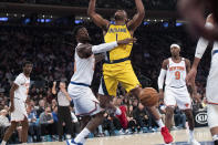 New York Knicks forward Julius Randle (30) fouls New York Knicks forward Bobby Portis (1) in the first half of an NBA basketball game, Friday, Feb. 21, 2020, at Madison Square Garden in New York. (AP Photo/Mary Altaffer)