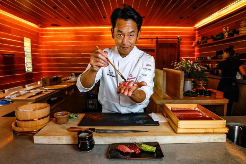 Chef Atsushi Okawara prepares a curated omakase dinner at The Den at Azabu on Miami Beach. The Den earned a Michelin star in 2020.