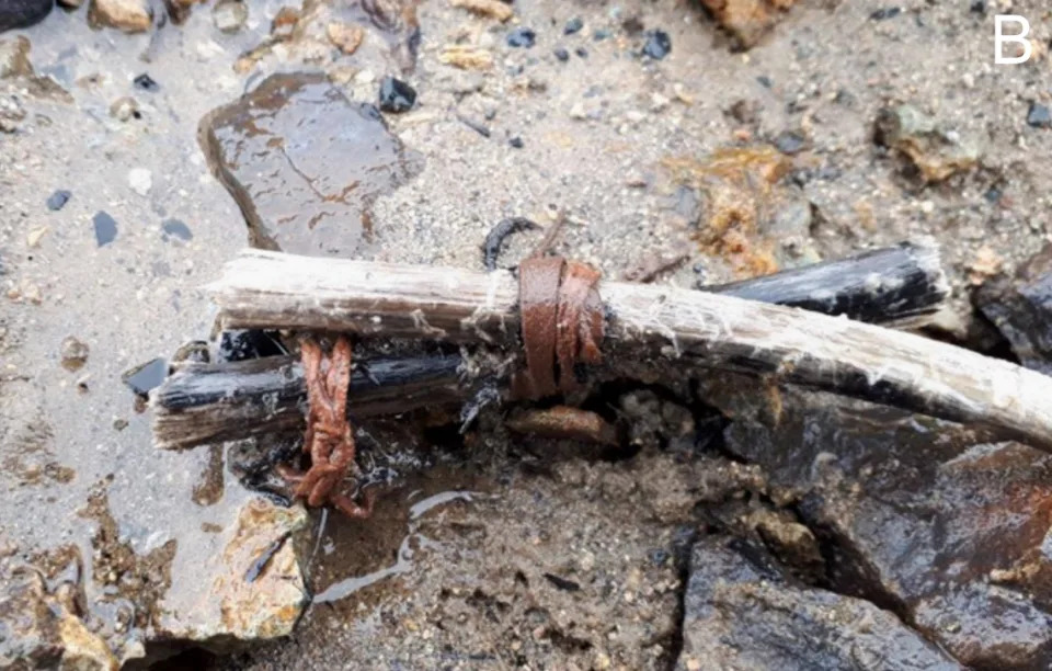 A 3,000-year-old pair of stick wrapped in animal hide found in the ice.